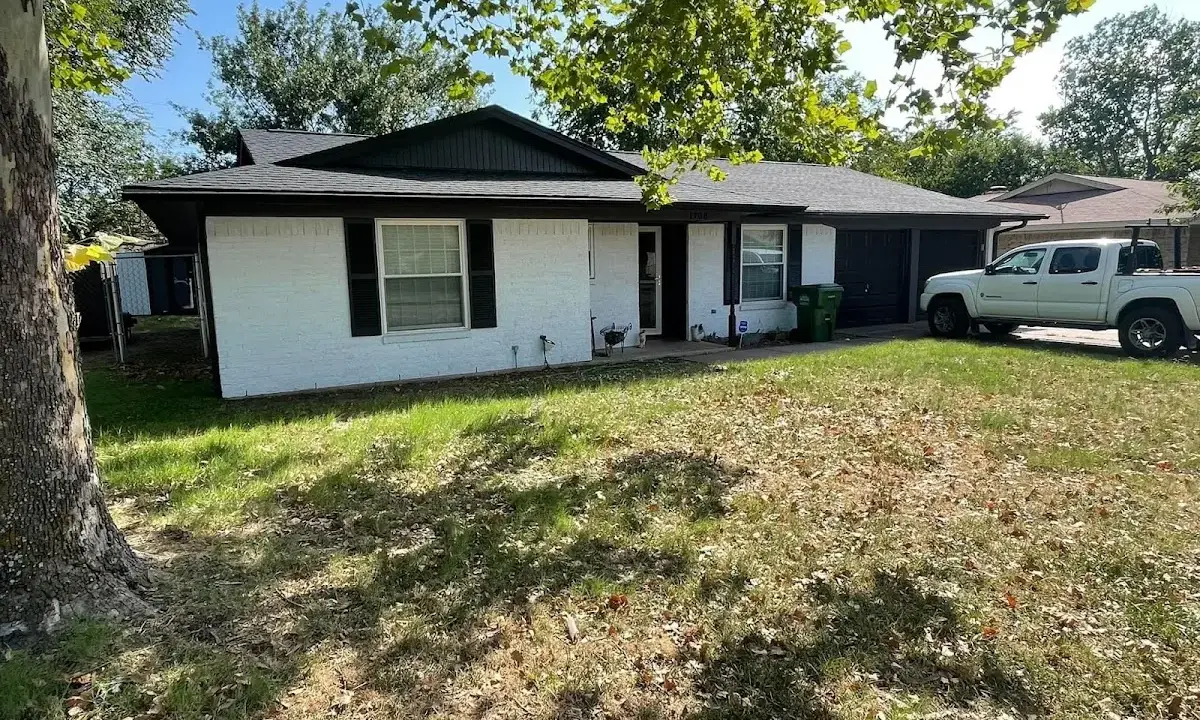 Professional roofing crew working on a residential roof in Glenwood